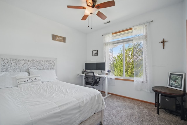 545 Maggie Ln, Altoona, IA 50009 - carpeted bedroom with baseboards, a ceiling fan, and an office area