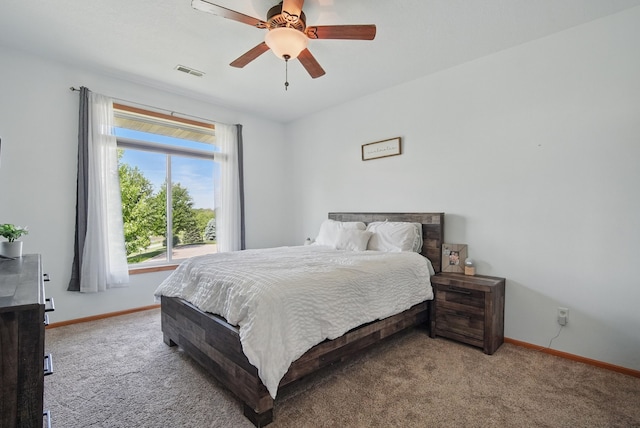 545 Maggie Ln, Altoona, IA 50009 - carpeted bedroom with baseboards and ceiling fan