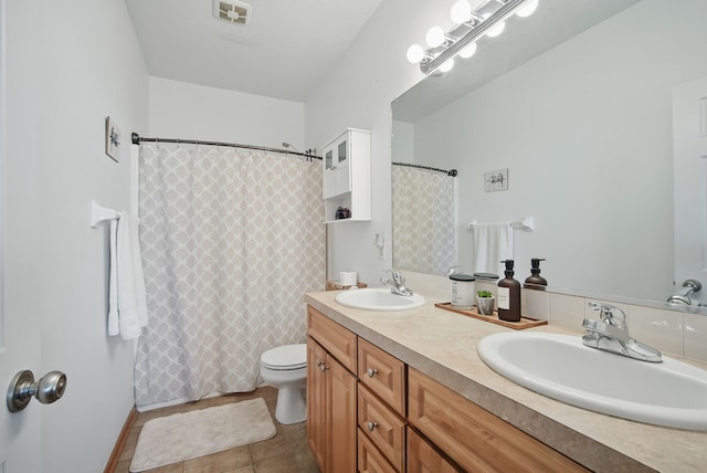 545 Maggie Ln, Altoona, IA 50009 - full bath with double vanity, tile patterned flooring, toilet, and a shower with shower curtain