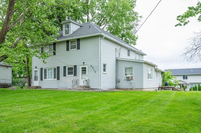 8717 Urbandale Ave, Urbandale, IA 50322 - back of property with a yard and a shingled roof