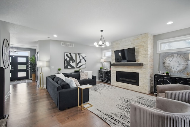16202 Brookview Dr, Urbandale, IA 50323 - living area with a chandelier, hardwood / wood-style floors, and a fireplace