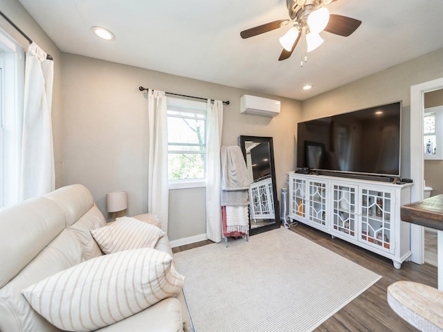 8117 Hickory St, Dexter, IA 50070 - living room with an AC wall unit, wood finished floors, baseboards, a ceiling fan, and recessed lighting