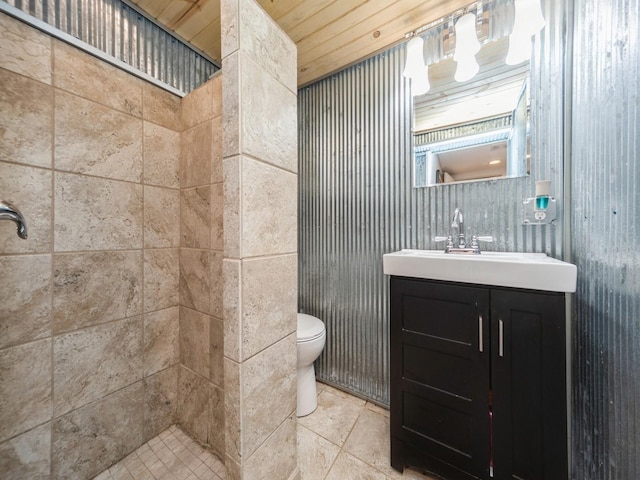 8117 Hickory St, Dexter, IA 50070 - full bathroom with toilet, vanity, and tiled shower