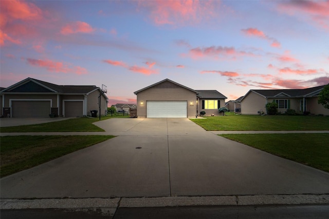 2009 NW Boulder Ridge Ln, Ankeny, IA 50023 - ranch-style home with concrete driveway, a front lawn, and a garage