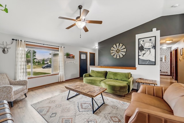 2009 NW Boulder Ridge Ln, Ankeny, IA 50023 - living area featuring vaulted ceiling, a ceiling fan, wood finished floors, and baseboards