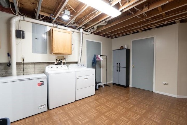 2002 12th St, Eldora, IA 50627 - clothes washing area featuring separate washer and dryer and cabinet space
