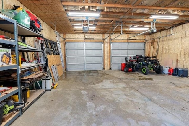 2002 12th St, Eldora, IA 50627 - garage featuring a garage door opener