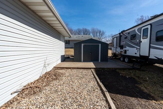 2002 12th St, Eldora, IA 50627 - view of side of home featuring a storage unit and an outdoor structure