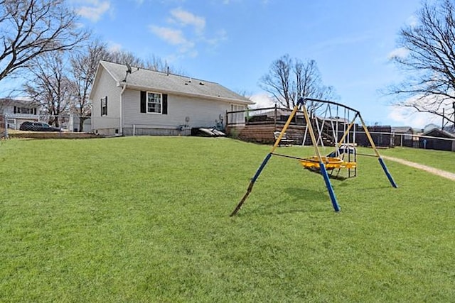 2002 12th St, Eldora, IA 50627 - rear view of house with a playground