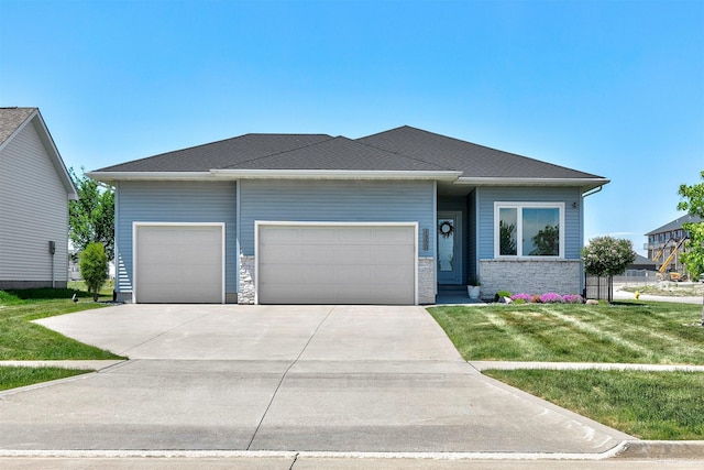 1350 97th St, West Des Moines, IA 50266 - view of front of house featuring a garage, driveway, and a front yard