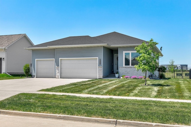 1350 97th St, West Des Moines, IA 50266 - view of front of property featuring a garage, driveway, and stone siding