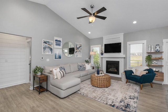 1350 97th St, West Des Moines, IA 50266 - living room featuring wood finished floors, plenty of natural light, ceiling fan, high vaulted ceiling, and recessed lighting