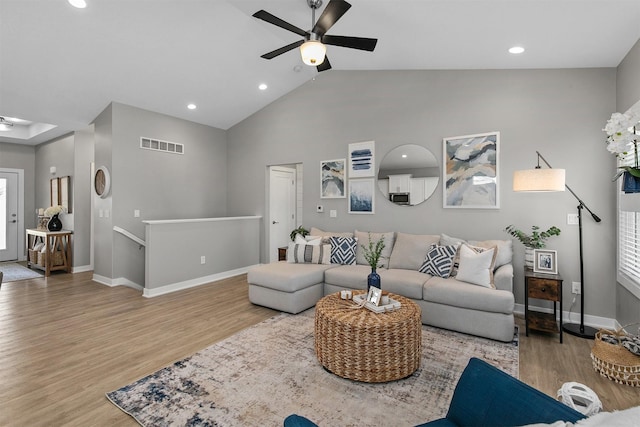 1350 97th St, West Des Moines, IA 50266 - living area featuring a ceiling fan, wood finished floors, baseboards, recessed lighting, and high vaulted ceiling