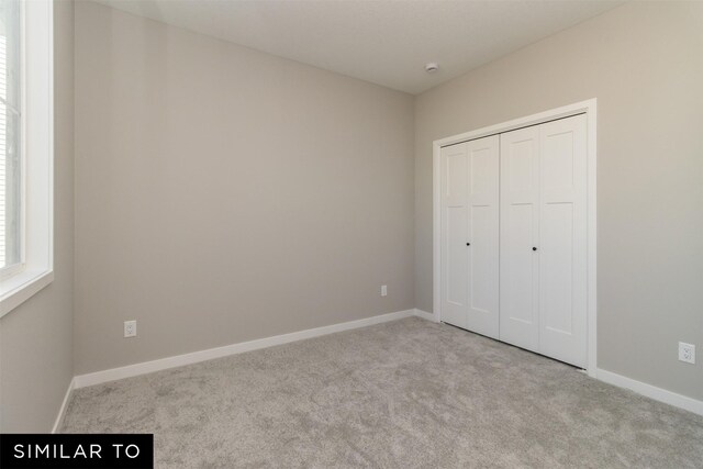 4120 NE 5th St, Ankeny, IA 50021 - unfurnished bedroom featuring carpet, baseboards, and a closet
