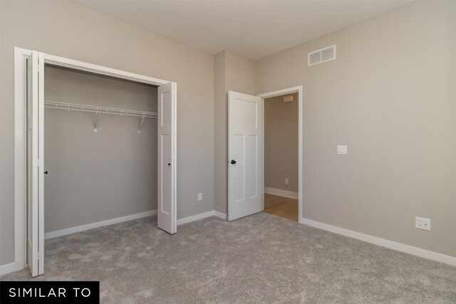 4120 NE 5th St, Ankeny, IA 50021 - unfurnished bedroom featuring carpet floors, a closet, and baseboards
