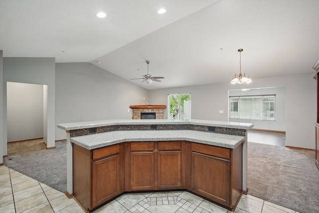 6082 Sheffield Cir, Johnston, IA 50131 - kitchen featuring open floor plan, light carpet, a stone fireplace, lofted ceiling, and a ceiling fan