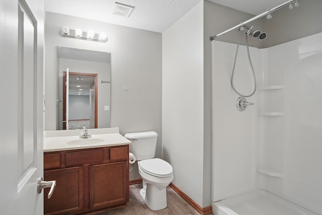 6082 Sheffield Cir, Johnston, IA 50131 - full bathroom with a shower stall, toilet, vanity, wood finished floors, and baseboards