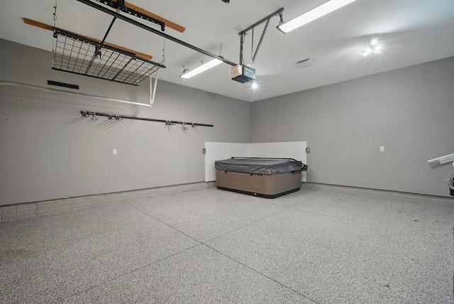 6082 Sheffield Cir, Johnston, IA 50131 - garage with a garage door opener and baseboards