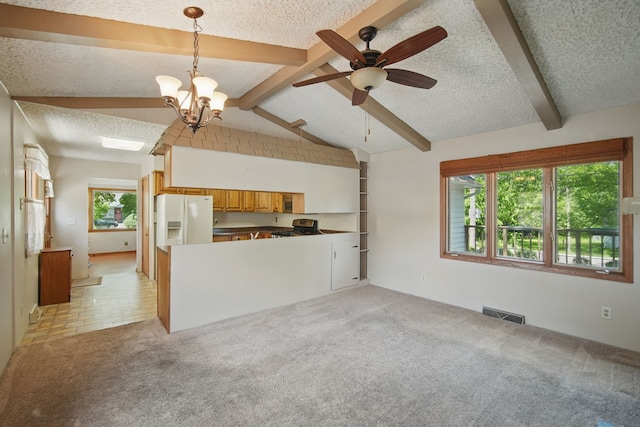 4147 E 7th St, Des Moines, IA 50313 - unfurnished living room featuring a textured ceiling, light colored carpet, a ceiling fan, and a chandelier
