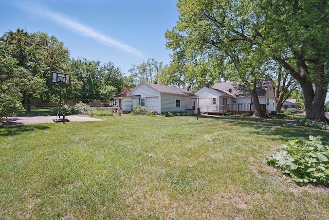 4147 E 7th St, Des Moines, IA 50313 - view of grassy yard featuring a deck and a patio area