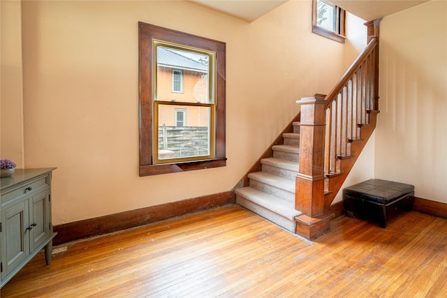 1014 14th St, Boone, IA 50036 - stairs featuring hardwood / wood-style floors and baseboards