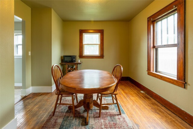 1014 14th St, Boone, IA 50036 - dining room featuring wood finished floors, healthy amount of natural light, and baseboards