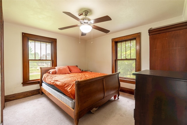 1014 14th St, Boone, IA 50036 - bedroom featuring light colored carpet, baseboards, and ceiling fan