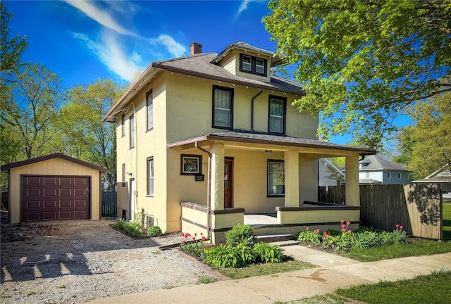 1014 14th St, Boone, IA 50036 - traditional style home featuring covered porch, an outbuilding, a chimney, and stucco siding