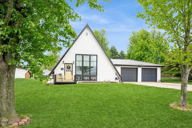 306 E Buchanan St, Baxter, IA 50028 - a-frame home with a front yard, a garage, and driveway