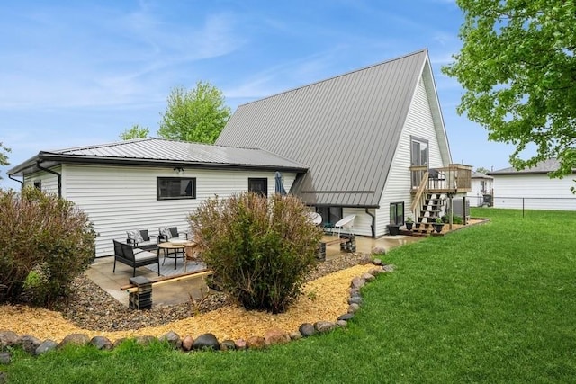 306 E Buchanan St, Baxter, IA 50028 - back of house with a patio and metal roof
