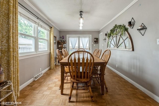 4511 66th St, Urbandale, IA 50322 - dining space with baseboards and crown molding