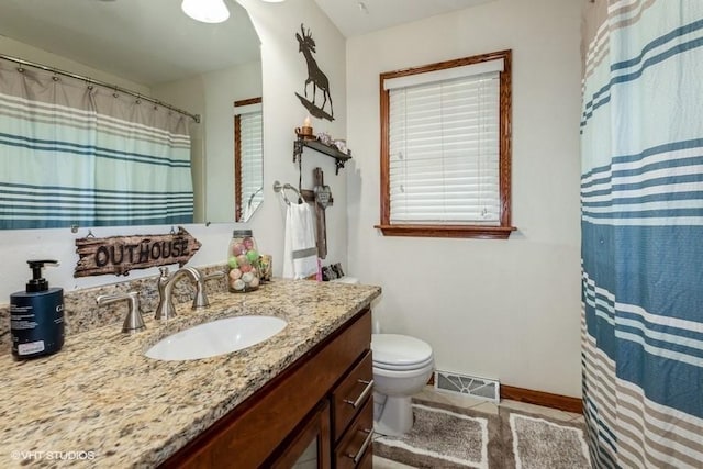 4511 66th St, Urbandale, IA 50322 - full bathroom with vanity, toilet, baseboards, and curtained shower