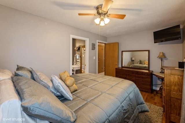 4511 66th St, Urbandale, IA 50322 - bedroom with wood finished floors, ceiling fan, and ensuite bathroom