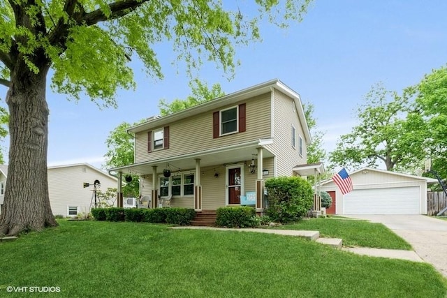 4511 66th St, Urbandale, IA 50322 - view of front of property with a porch, a detached garage, and a front yard