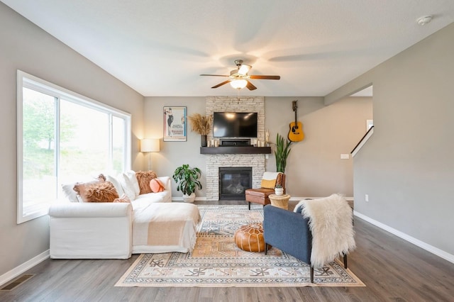 1085 Juniper Dr, Carlisle, IA 50047 - living room featuring a ceiling fan, plenty of natural light, baseboards, and wood finished floors