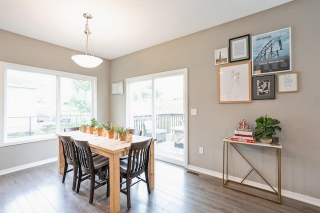 1085 Juniper Dr, Carlisle, IA 50047 - dining area featuring wood finished floors and baseboards