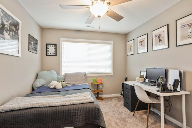 1085 Juniper Dr, Carlisle, IA 50047 - bedroom featuring light colored carpet, an office area, baseboards, and ceiling fan