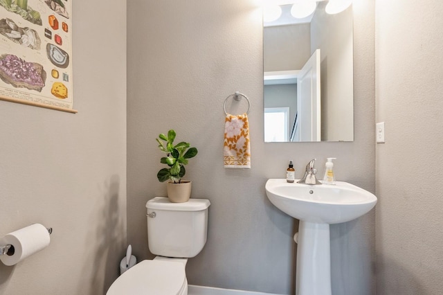 1085 Juniper Dr, Carlisle, IA 50047 - bathroom with toilet and a sink
