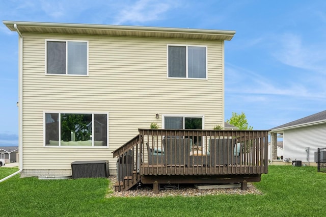 1085 Juniper Dr, Carlisle, IA 50047 - rear view of house featuring a deck, a lawn, and central AC