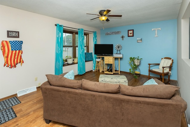 2209 8th Street Ct SW, Altoona, IA 50009 - living room featuring a ceiling fan, wood finished floors, and baseboards