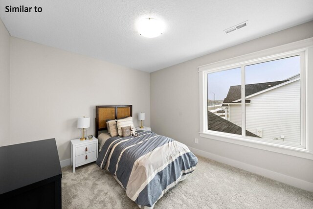 2228 Green Leaf Cir, Norwalk, IA 50211 - carpeted bedroom featuring baseboards