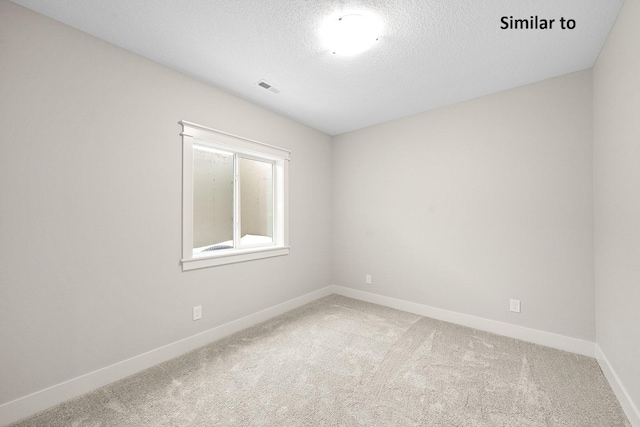 2228 Green Leaf Cir, Norwalk, IA 50211 - empty room with carpet, baseboards, and a textured ceiling
