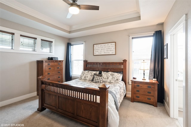 2817 Partlow St, Norwalk, IA 50211 - bedroom featuring light carpet, a tray ceiling, ornamental molding, baseboards, and a ceiling fan