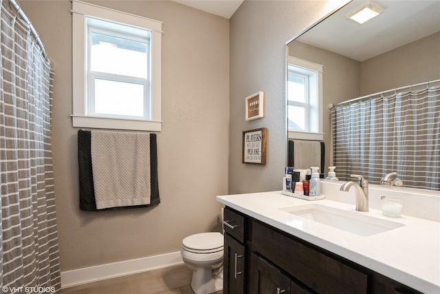 2817 Partlow St, Norwalk, IA 50211 - full bathroom with toilet, baseboards, vanity, and a shower with shower curtain