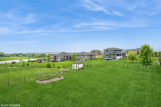 2817 Partlow St, Norwalk, IA 50211 - view of yard featuring a residential view and a vegetable garden