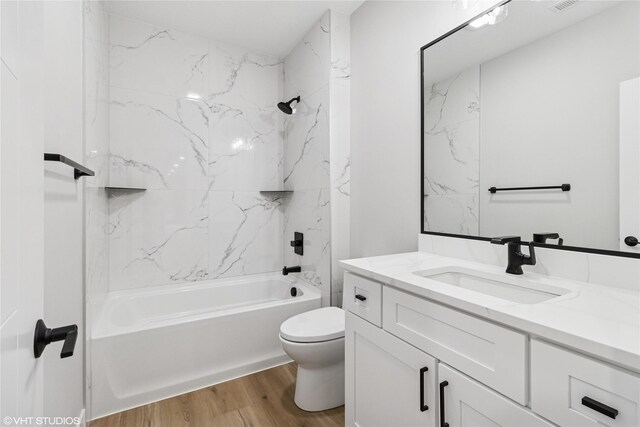 17400 Springbrook Trl, Urbandale, IA 50111 - full bath with wood finished floors, toilet, shower / bath combination, and vanity