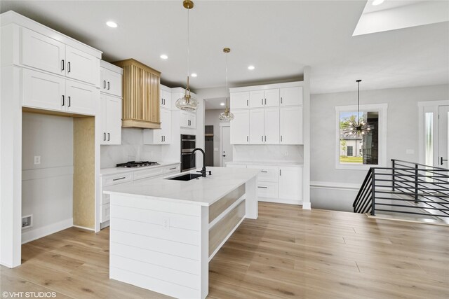 17400 Springbrook Trl, Urbandale, IA 50111 - kitchen featuring appliances with stainless steel finishes, backsplash, a sink, light countertops, and recessed lighting