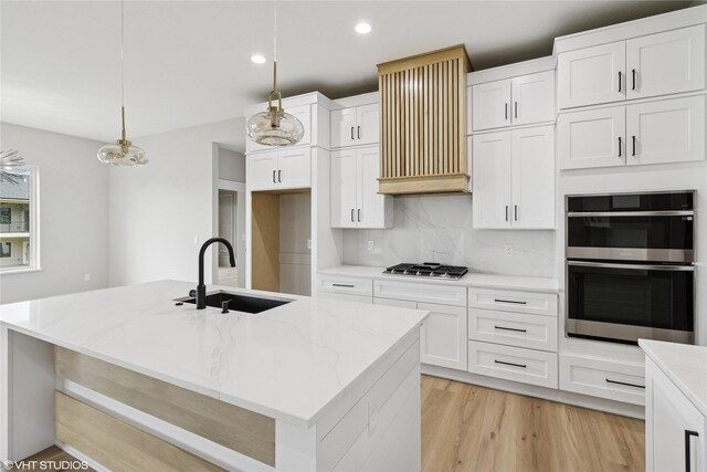 17400 Springbrook Trl, Urbandale, IA 50111 - kitchen with a sink, stainless steel appliances, decorative backsplash, light stone countertops, and white cabinets