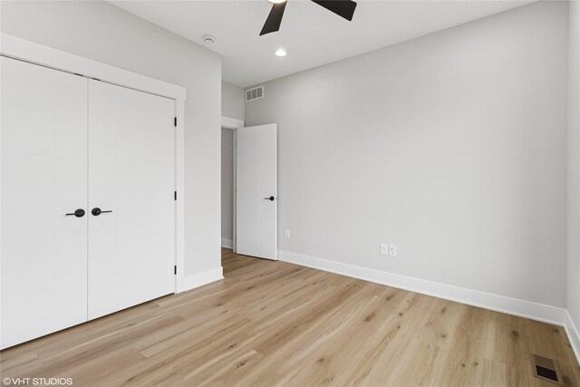 17400 Springbrook Trl, Urbandale, IA 50111 - unfurnished bedroom featuring a closet, light wood-type flooring, baseboards, ceiling fan, and recessed lighting