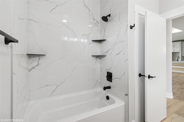 17400 Springbrook Trl, Urbandale, IA 50111 - full bathroom featuring  shower combination, wood finished floors, and a sink